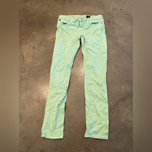 Mint green AG slim straight leg jeans.